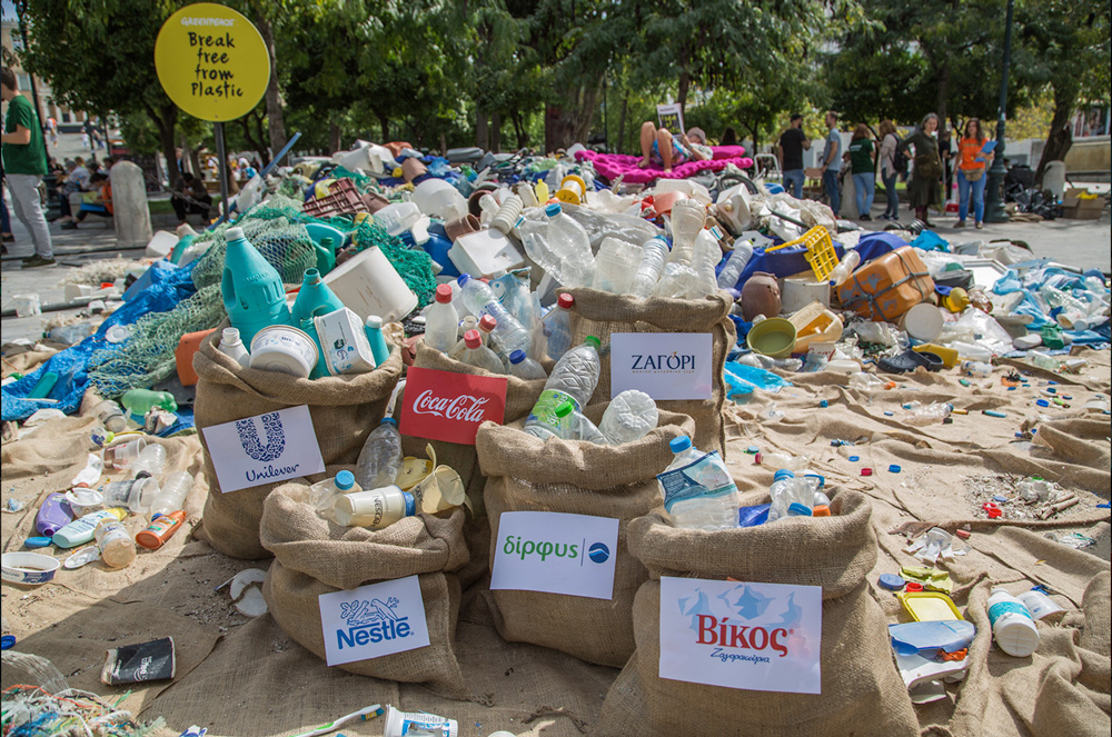 Sacks of different brands are stacked on top of one another. Coca-cola, Unilever, and Nestle among the brands collected in the Brand Audit 2018 in Greece.