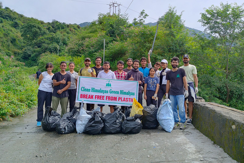 A group of volunteers posing for a photo after a cleanup